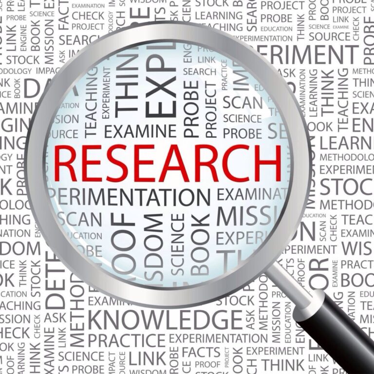 Magnifying glass showing the word RESEARCH in red letters