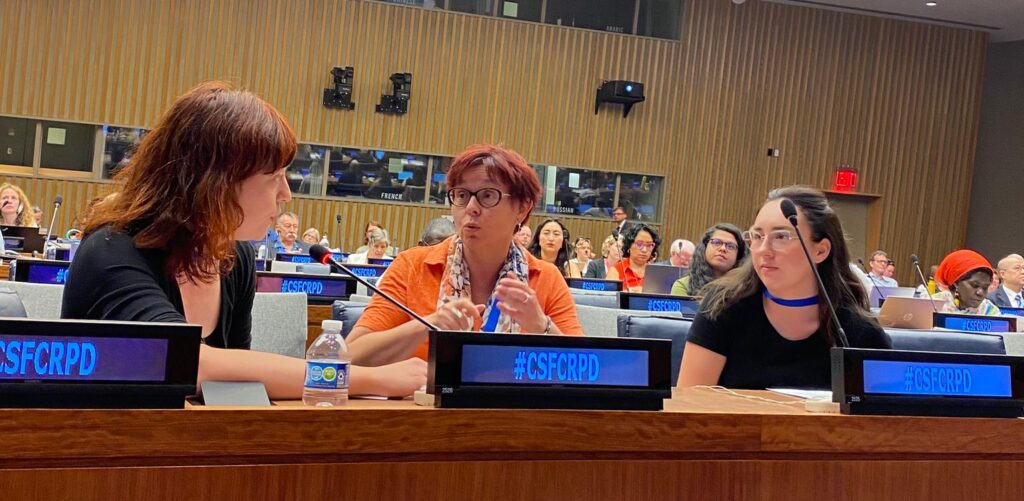 Three women at a conference