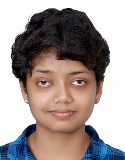 Headshot of Shrutilata, A brown woman with short hair